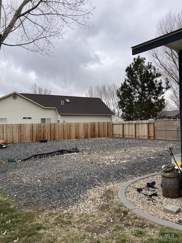 exterior space featuring a fenced backyard