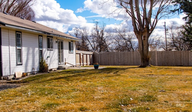 view of yard with entry steps and fence