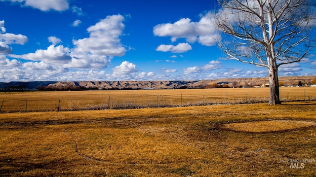 view of mountain feature with a rural view