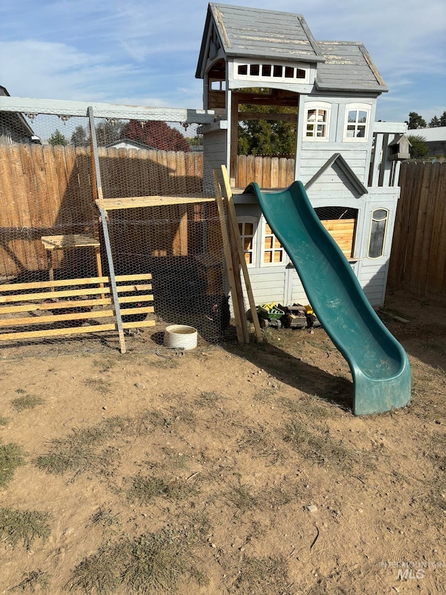 view of play area with an outdoor structure