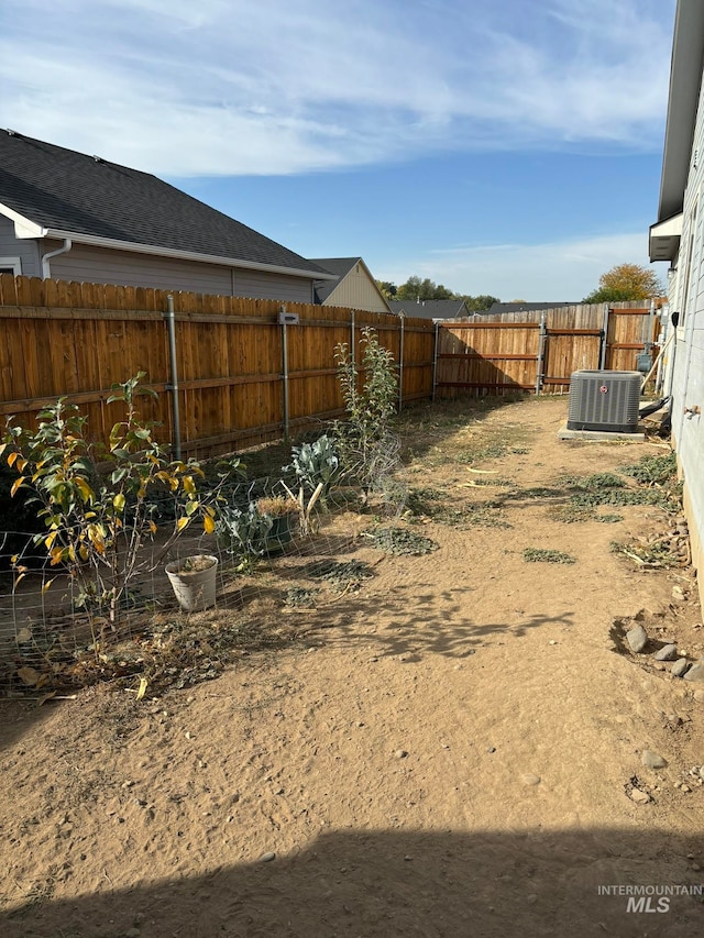 view of yard featuring central AC