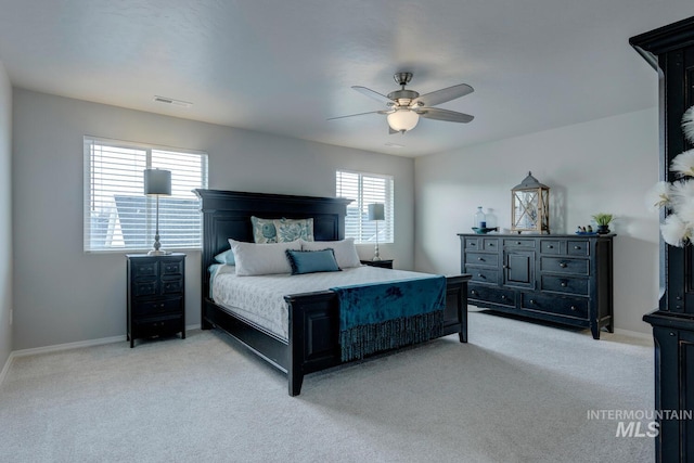 bedroom with carpet, baseboards, ceiling fan, and visible vents