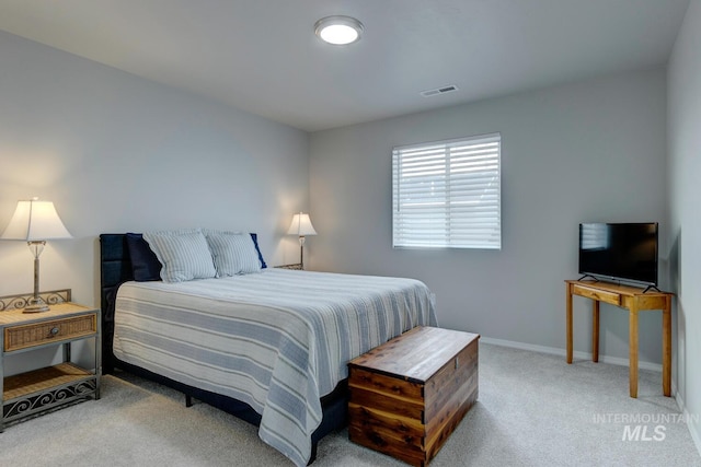 bedroom with baseboards, carpet floors, and visible vents