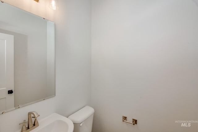 bathroom featuring sink and toilet