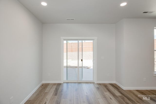 spare room with light wood-type flooring