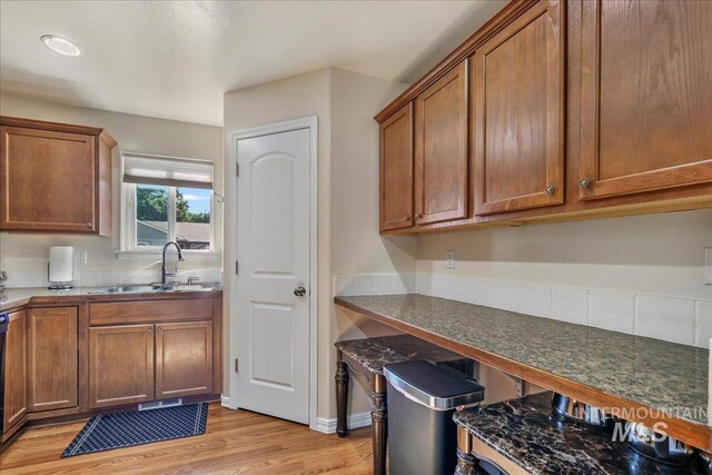 1128 W Wirsching Ave, Twin Falls, ID 83301 - kitchen featuring light wood-type flooring and brown cabinets