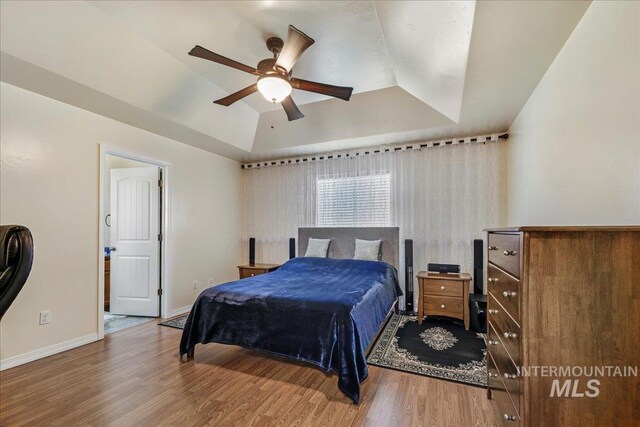 1128 W Wirsching Ave, Twin Falls, ID 83301 - bedroom featuring a raised ceiling, wood finished floors, and ceiling fan