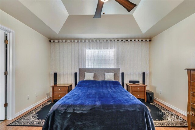 1128 W Wirsching Ave, Twin Falls, ID 83301 - bedroom with wood finished floors, vaulted ceiling, and ceiling fan
