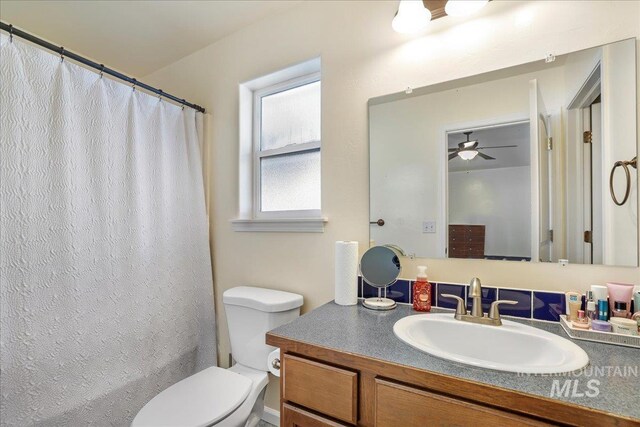 1128 W Wirsching Ave, Twin Falls, ID 83301 - full bath featuring vanity, ceiling fan, and a shower with shower curtain