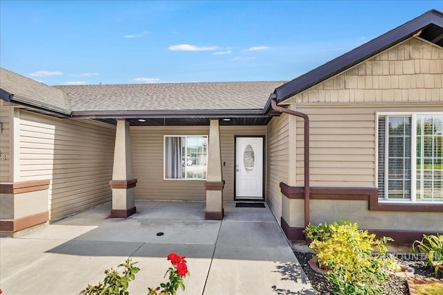 1128 W Wirsching Ave, Twin Falls, ID 83301 - doorway to property featuring a shingled roof and a porch