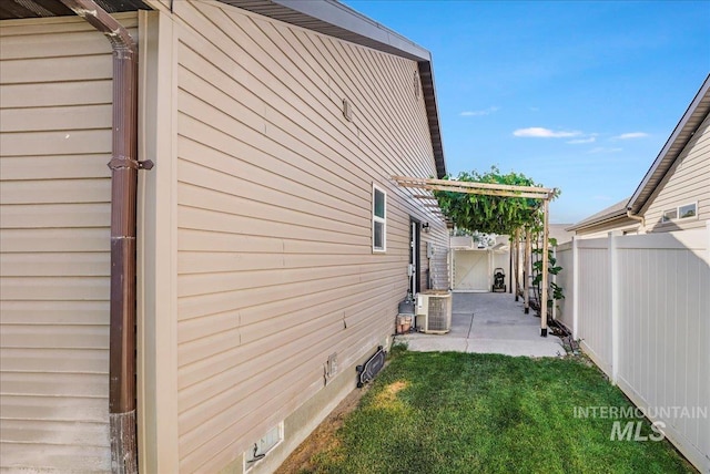 1128 W Wirsching Ave, Twin Falls, ID 83301 - view of side of property with a patio and a cooling unit