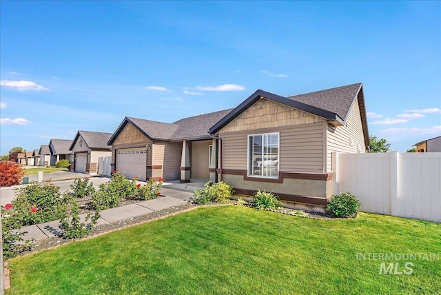 1128 W Wirsching Ave, Twin Falls, ID 83301 - view of front of home with a garage, concrete driveway, and a shingled roof