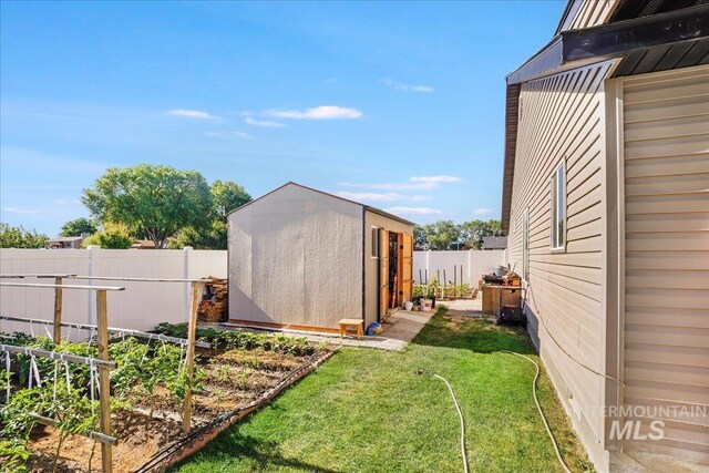 1128 W Wirsching Ave, Twin Falls, ID 83301 - fenced backyard with a shed and a garden