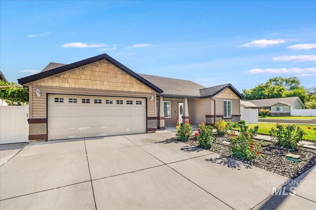 1128 W Wirsching Ave, Twin Falls, ID 83301 - ranch-style home featuring an attached garage and concrete driveway