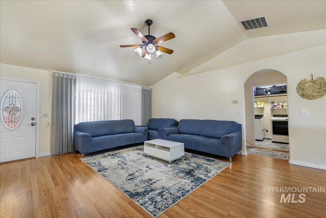 1128 W Wirsching Ave, Twin Falls, ID 83301 - living area with ceiling fan, vaulted ceiling, arched walkways, and wood finished floors