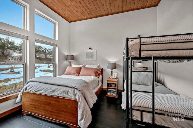 bedroom featuring ornamental molding, lofted ceiling, and wooden ceiling