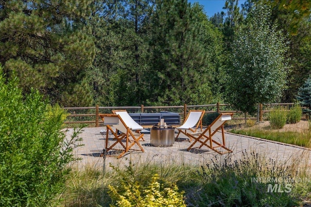 view of patio featuring a fire pit