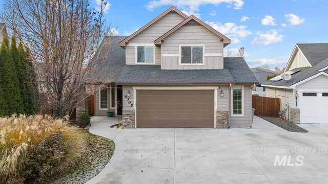 craftsman house with a garage