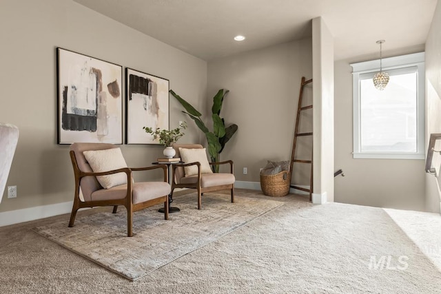 living area featuring carpet floors