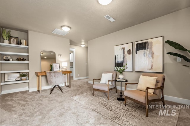 living area with carpet floors