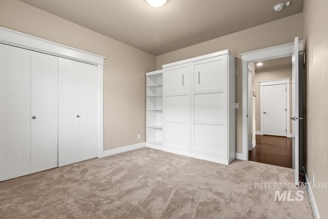 unfurnished bedroom featuring carpet floors