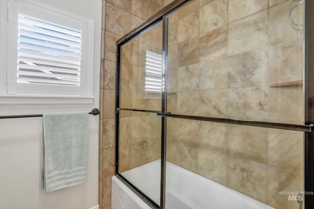 full bath with bath / shower combo with glass door