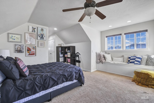 carpeted bedroom with baseboards, recessed lighting, ceiling fan, vaulted ceiling, and a textured ceiling