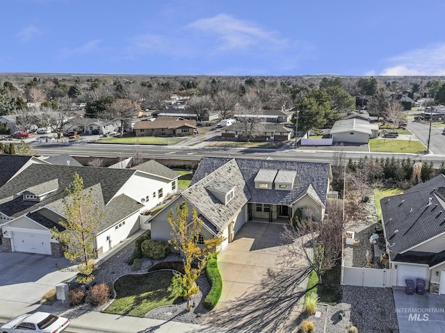 birds eye view of property with a residential view