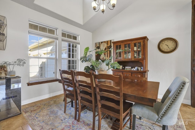 dining room featuring baseboards, high vaulted ceiling, an inviting chandelier, and light tile patterned flooring