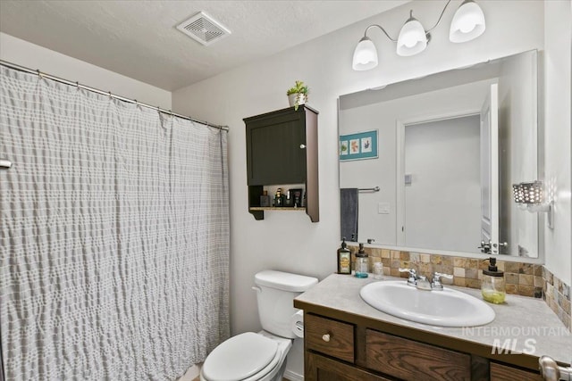 5416 Junegrass Way, Caldwell, ID 83607 - bathroom featuring vanity, toilet, a shower with shower curtain, and tasteful backsplash