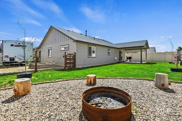 5416 Junegrass Way, Caldwell, ID 83607 - rear view of house featuring board and batten siding, a fire pit, and a patio area