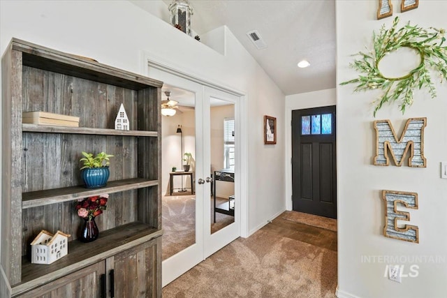 5416 Junegrass Way, Caldwell, ID 83607 - entrance foyer with french doors, carpet flooring, baseboards, and vaulted ceiling