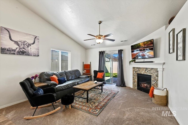 5416 Junegrass Way, Caldwell, ID 83607 - carpeted living area with vaulted ceiling, a textured ceiling, a ceiling fan, a fireplace, and baseboards