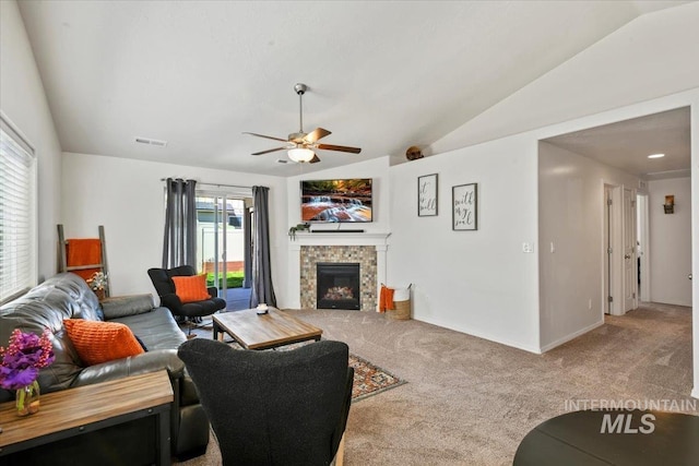 5416 Junegrass Way, Caldwell, ID 83607 - living room featuring carpet, vaulted ceiling, ceiling fan, a fireplace, and baseboards