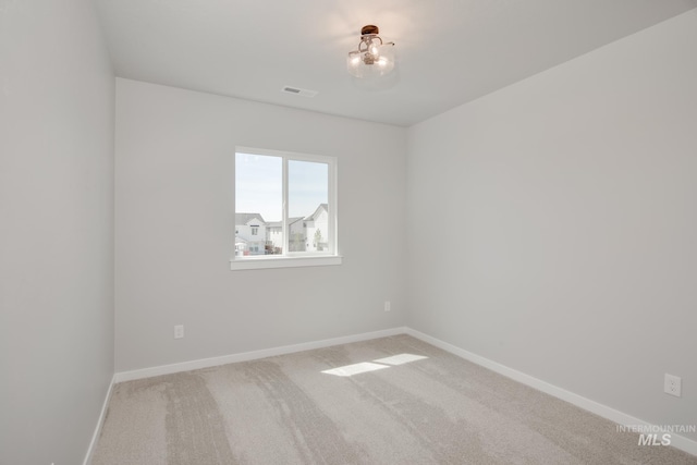 empty room featuring carpet flooring