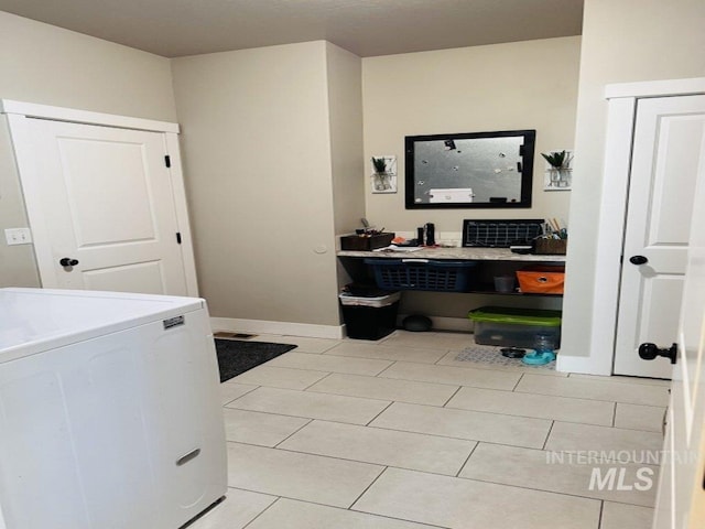 805 Drayton Ave, Twin Falls, ID 83301 - laundry room featuring washer / clothes dryer, light tile patterned flooring, a desk, and baseboards