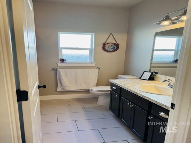 805 Drayton Ave, Twin Falls, ID 83301 - bathroom with tile patterned flooring, vanity, and toilet