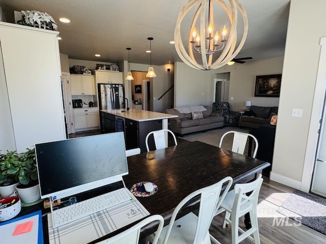 805 Drayton Ave, Twin Falls, ID 83301 - dining space with a chandelier, light wood-style flooring, baseboards, and recessed lighting