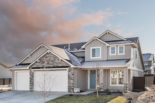 craftsman inspired home featuring a yard and a garage