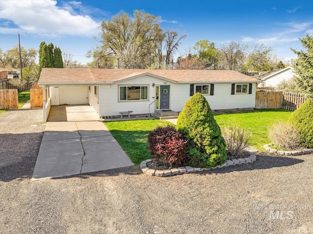 single story home featuring a carport and a front lawn