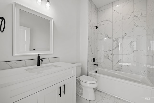 full bathroom with vanity, tiled shower / bath combo, and toilet