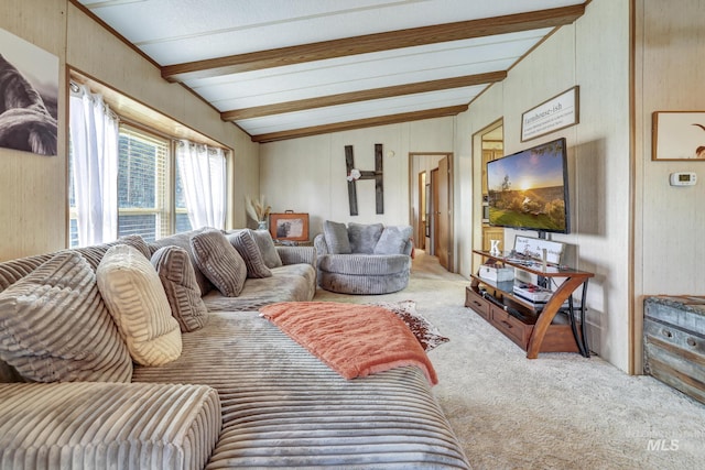 carpeted living room featuring vaulted ceiling with beams