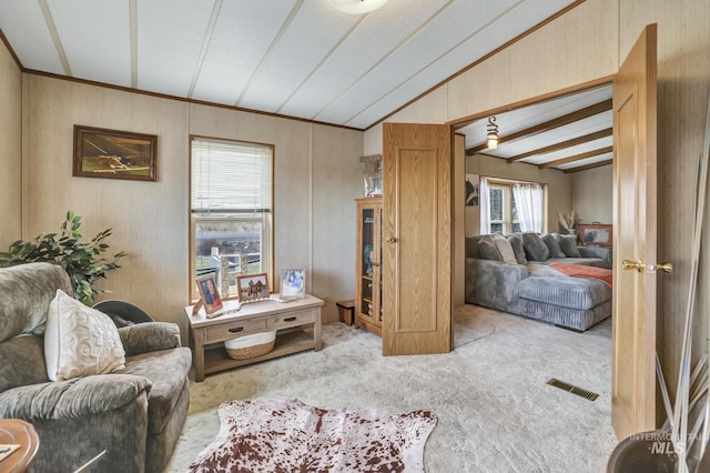 living room featuring light colored carpet and vaulted ceiling