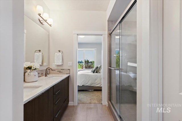 18245 N Arch Haven Way, Nampa, ID 83687 - bathroom with ensuite bath, a shower stall, double vanity, and tile patterned flooring