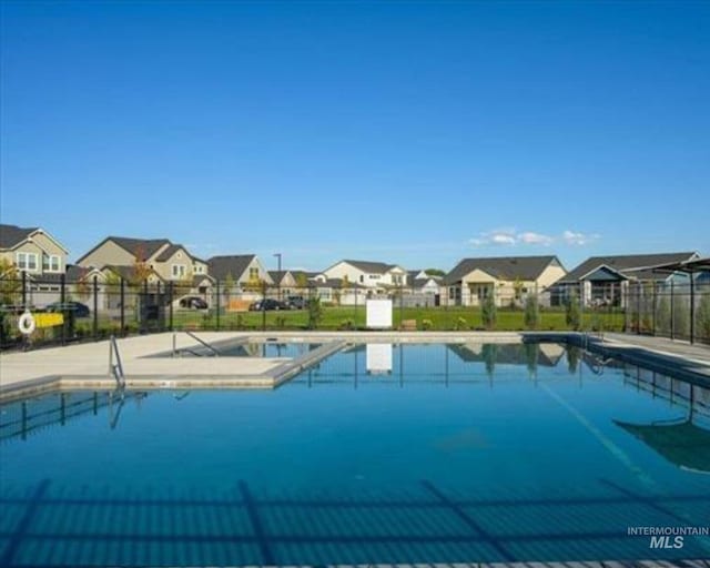 18245 N Arch Haven Way, Nampa, ID 83687 - community pool featuring a residential view and fence