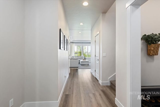 18245 N Arch Haven Way, Nampa, ID 83687 - hallway with wood finished floors, baseboards, and recessed lighting