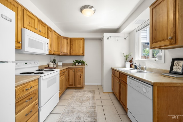 8305 W Rifleman St, Boise, ID 83704 - kitchen with white appliances, a sink, light countertops, and light tile patterned floors