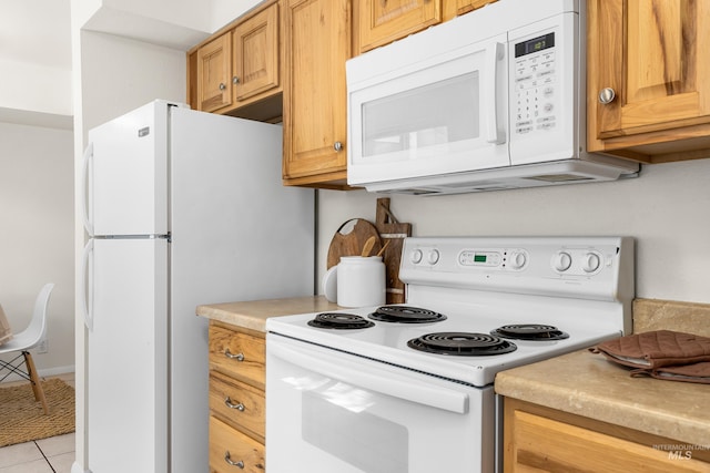 8305 W Rifleman St, Boise, ID 83704 - kitchen with white appliances, light countertops, and light tile patterned flooring