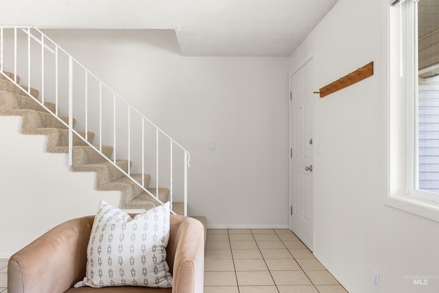 8305 W Rifleman St, Boise, ID 83704 - entrance foyer featuring stairway, light tile patterned floors, and baseboards