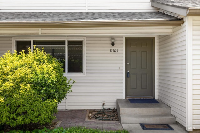 8305 W Rifleman St, Boise, ID 83704 - property entrance with roof with shingles